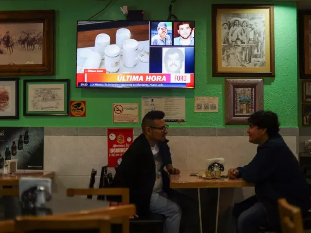 patrons talk and drink next to a tv showing the news of the arrest of mexican drug lord ismael el mayo zambada and the son of his former partner joaquin el chapo guzman at a private airport in el paso texas at a cantina in mexico city mexico july 25 2024 photo reuters patrons talk and drink next to a tv showing the news of the arrest of mexican drug lord ismael el mayo zambada and the son of his former partner joaquin el chapo guzman at a private airport in el paso texas at a cantina in mexico city mexico july 25 2024 photo reuters